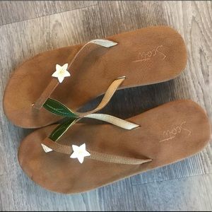 Flip flop sandals with a flower